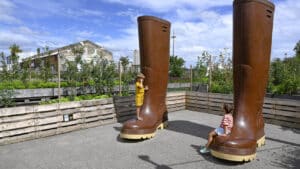 The giant wellies in front of the garden are a particular source of amazement for the children. Photo: Hilke Maunder