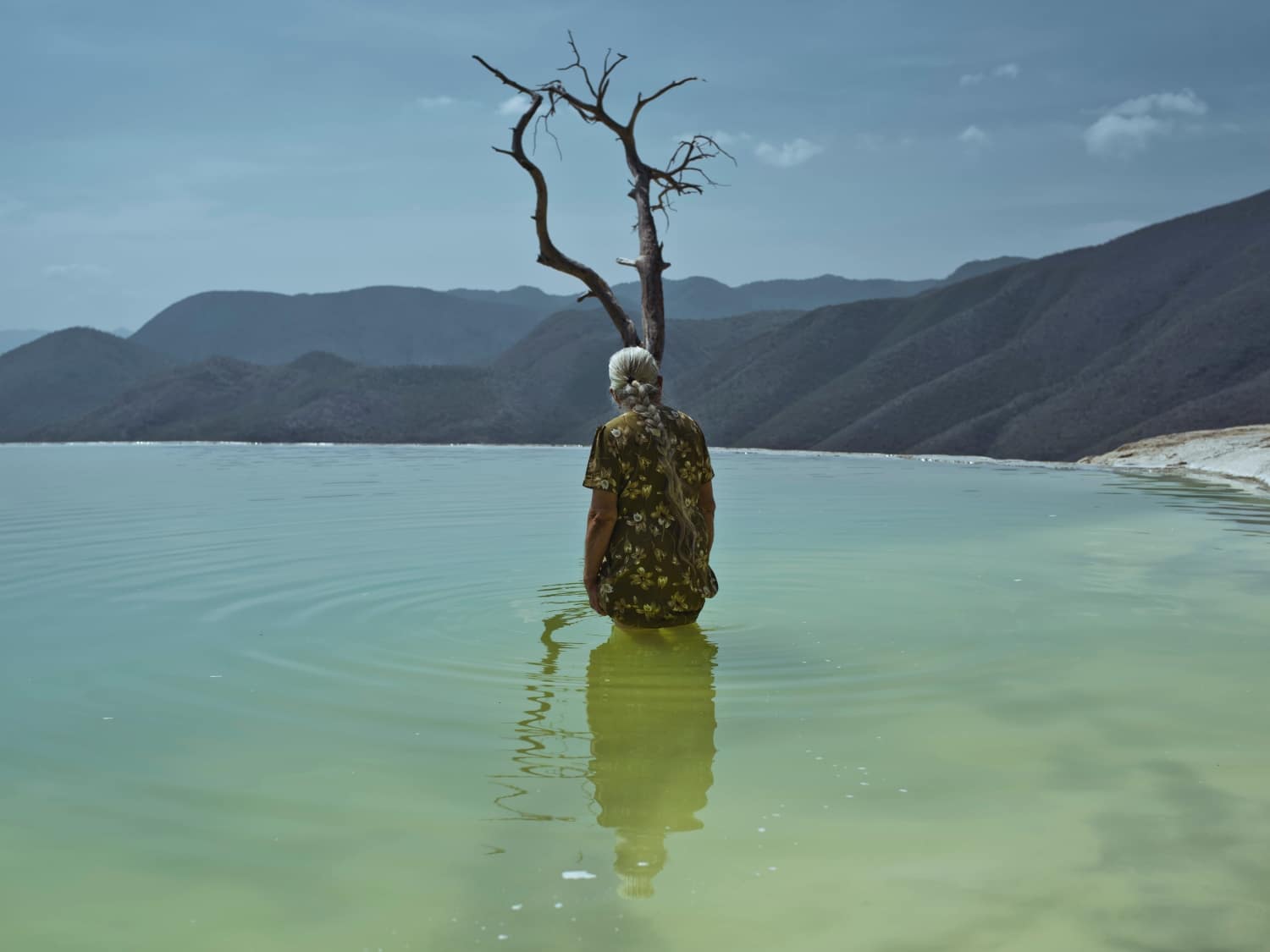 Cristina de Middel, Hierve el Agua are petrified waterfalls and sulfuric spring source located in the state of Oaxaca. Despite the growing affluence of tourists, it remains a sacred place for natives. Mexico, 2019 © Cristina De Middel/Magnum Photos