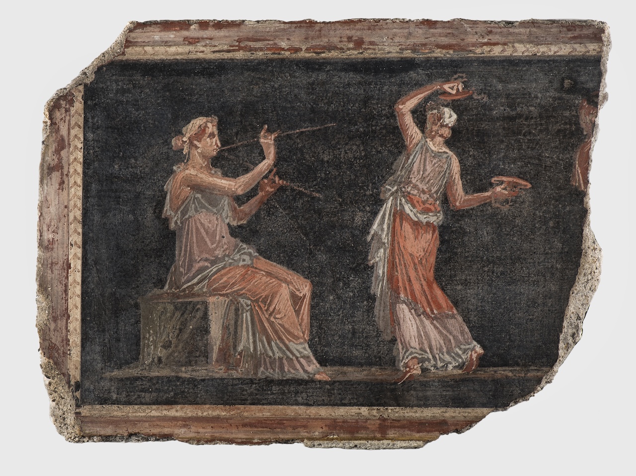 Fresko aus Herculaneum. Musikantin mit Flöte und Tanzende mit Zimbeln. © Staatliche Antikensammlungen und Glyptothek/Renate Kühling